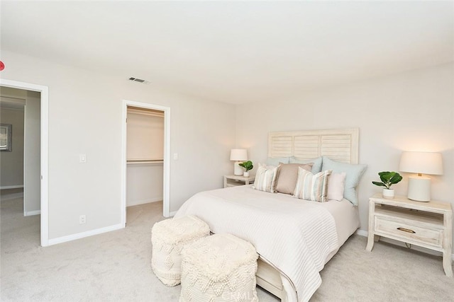 385 Park Ave, Long Beach, CA 90814 - bedroom with visible vents, baseboards, a spacious closet, and light carpet