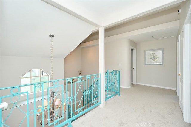 385 Park Ave, Long Beach, CA 90814 - corridor with carpet floors, baseboards, lofted ceiling, and an upstairs landing