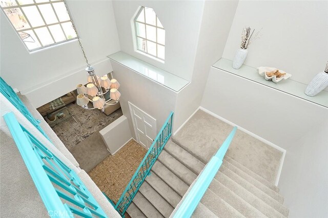 385 Park Ave, Long Beach, CA 90814 - interior space featuring a healthy amount of sunlight, baseboards, and a chandelier