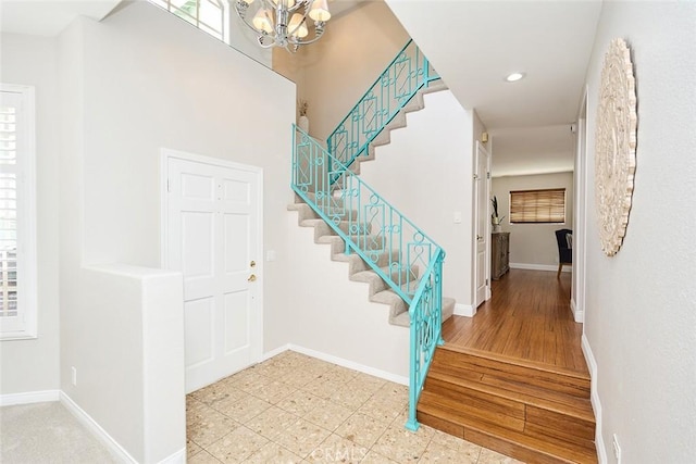 385 Park Ave, Long Beach, CA 90814 - foyer entrance with baseboards, a notable chandelier, and stairway