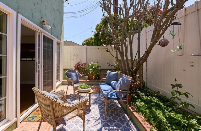 385 Park Ave, Long Beach, CA 90814 - view of patio / terrace with a fenced backyard and an outdoor hangout area