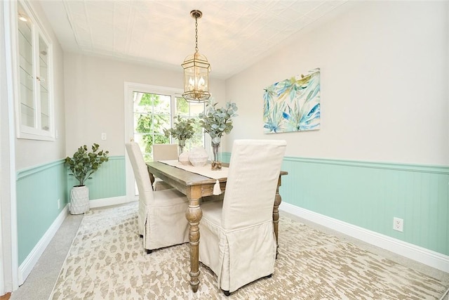 385 Park Ave, Long Beach, CA 90814 - dining area featuring an inviting chandelier and wainscoting