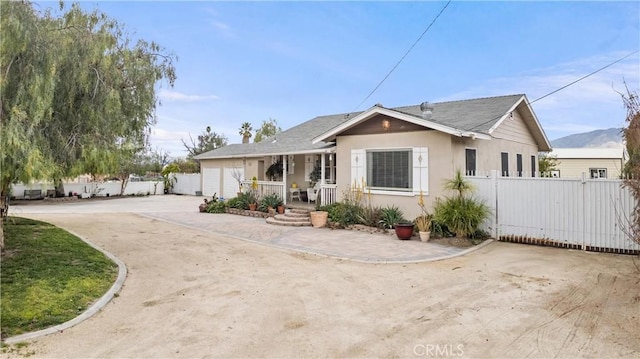 681 E Washington Ave, San Jacinto, CA 92583 - view of front of property with driveway, fence, an attached garage, and stucco siding