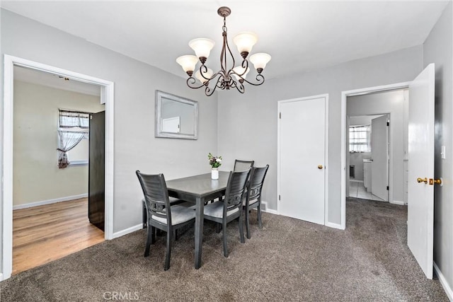 681 E Washington Ave, San Jacinto, CA 92583 - dining room with carpet flooring, a chandelier, plenty of natural light, and baseboards