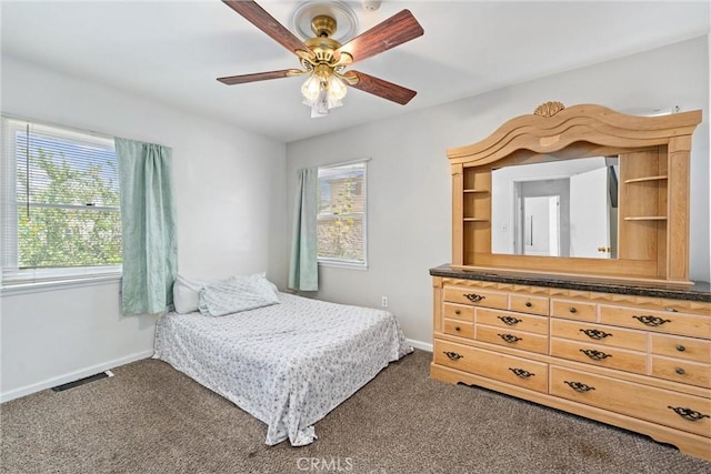 681 E Washington Ave, San Jacinto, CA 92583 - bedroom with dark colored carpet, baseboards, and ceiling fan