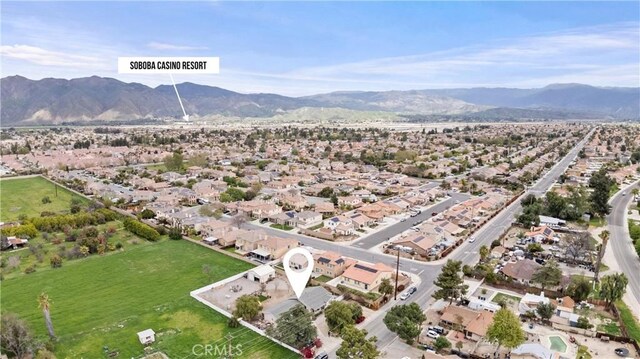 681 E Washington Ave, San Jacinto, CA 92583 - aerial overview of property's location featuring a mountainous background and nearby suburban area