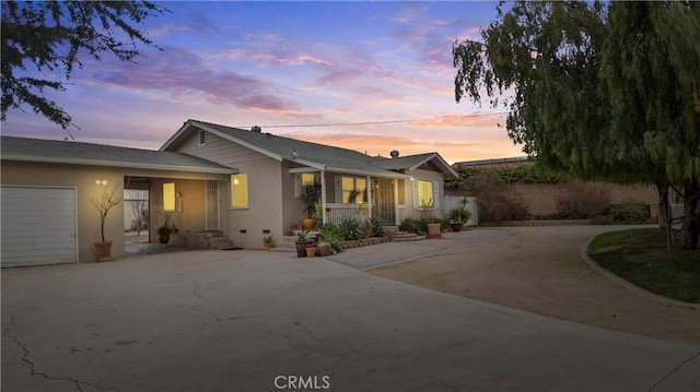 681 E Washington Ave, San Jacinto, CA 92583 - single story home featuring driveway, stucco siding, and an attached garage