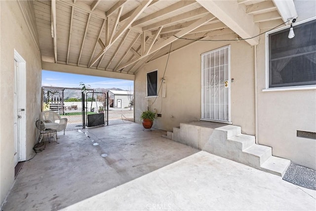 681 E Washington Ave, San Jacinto, CA 92583 - view of patio featuring a gate, fence, and a carport