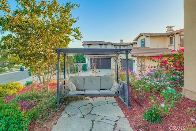 exterior space with a pergola and an outdoor living space