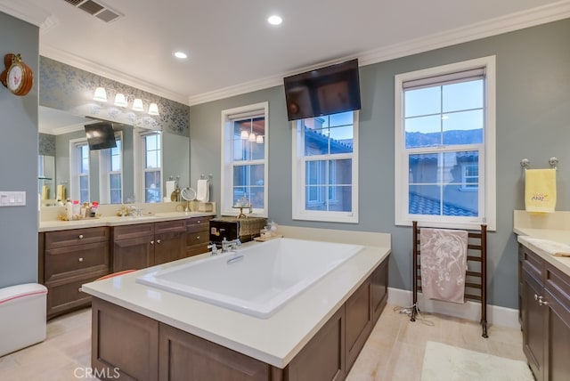 full bathroom featuring baseboards, ornamental molding, vanity, and plenty of natural light