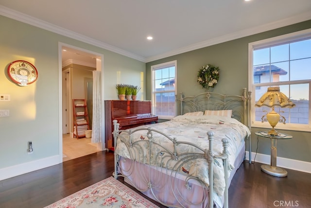 bedroom featuring baseboards, crown molding, wood finished floors, and recessed lighting
