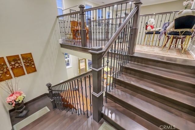 staircase with wood finished floors