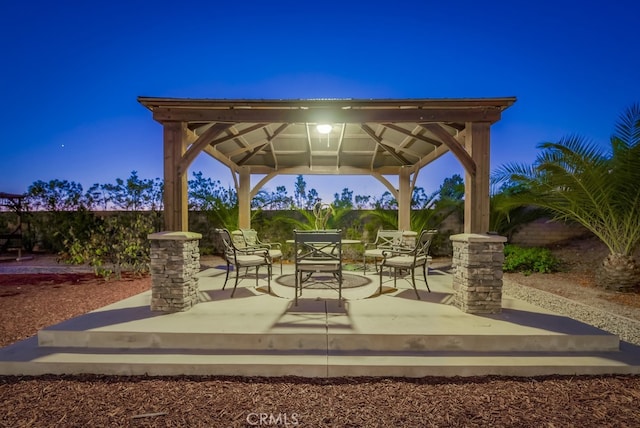surrounding community featuring a gazebo and a wooden deck