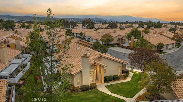 aerial view featuring a mountain view and a residential view