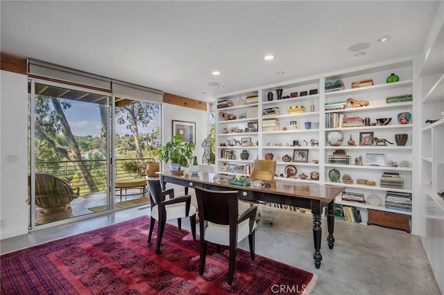 1503 Skylark Ln, Los Angeles, CA 90069 - home office featuring expansive windows, built in features, finished concrete floors, and recessed lighting