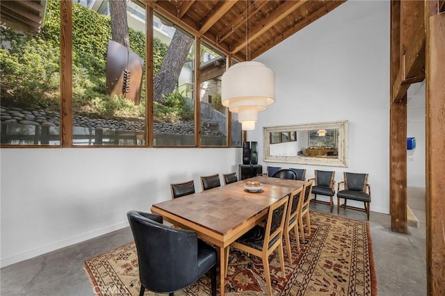 1503 Skylark Ln, Los Angeles, CA 90069 - dining space featuring concrete flooring, baseboards, and wood ceiling
