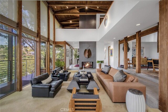 1503 Skylark Ln, Los Angeles, CA 90069 - living area featuring wood ceiling, high vaulted ceiling, beamed ceiling, and a fireplace