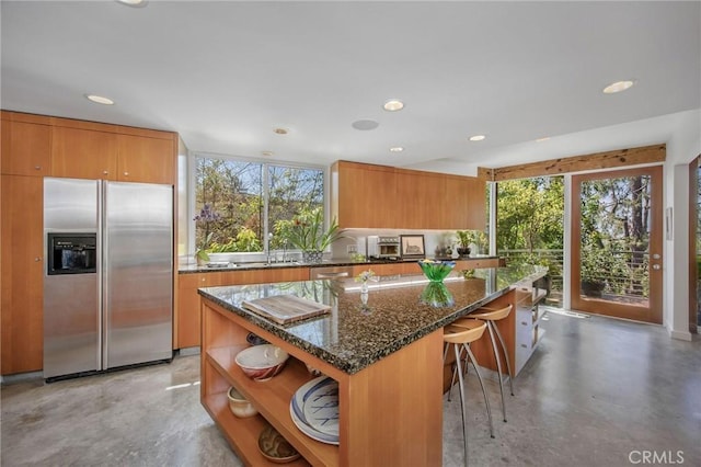 1503 Skylark Ln, Los Angeles, CA 90069 - kitchen featuring stainless steel fridge with ice dispenser, dark stone counters, finished concrete floors, and open shelves