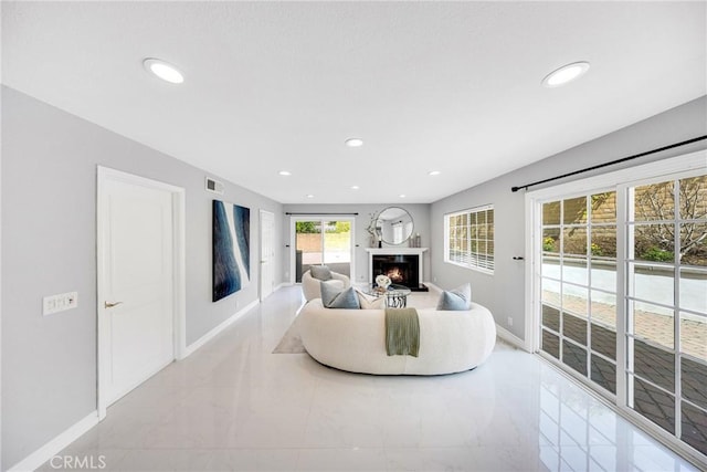 960 S Joliet Cir, Anaheim Hills, CA 92807 - living area with baseboards, a warm lit fireplace, marble finish floors, and recessed lighting