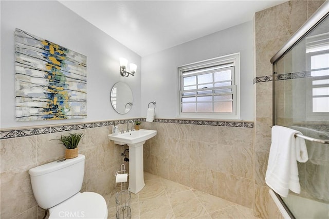 960 S Joliet Cir, Anaheim Hills, CA 92807 - bathroom featuring tile walls, a tile shower, toilet, wainscoting, and tile patterned floors
