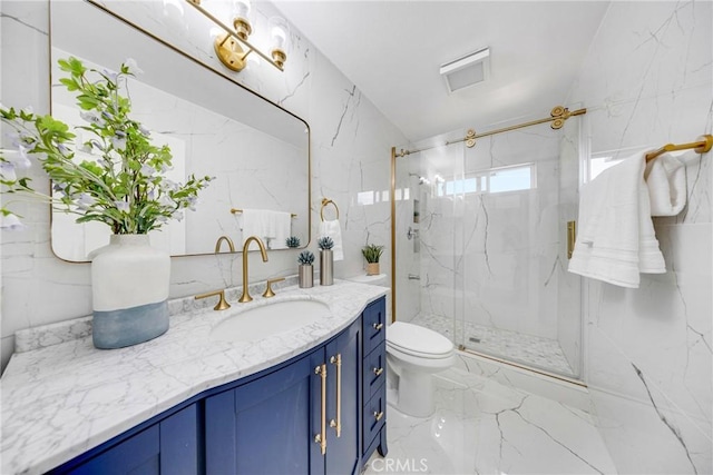 full bath with marble finish floor, toilet, vanity, and a marble finish shower