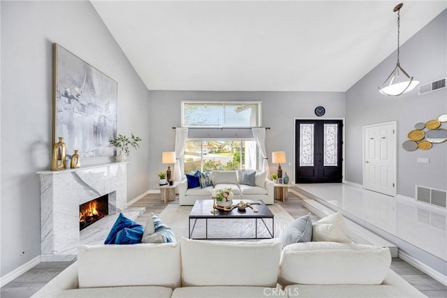 960 S Joliet Cir, Anaheim Hills, CA 92807 - living area featuring high vaulted ceiling, wood finished floors, a fireplace, and baseboards