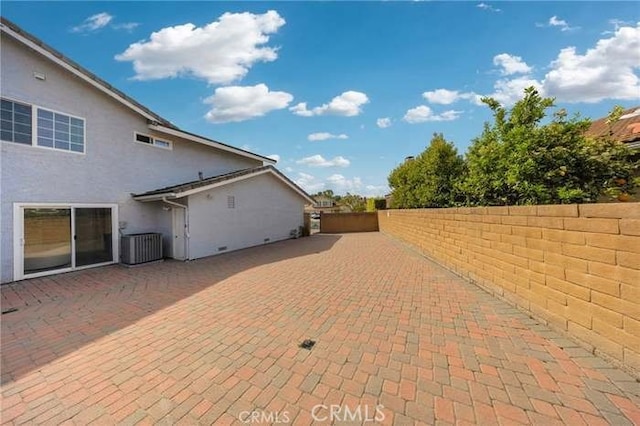 view of patio / terrace with a fenced backyard and central AC