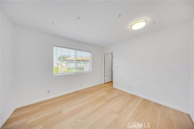 960 S Joliet Cir, Anaheim Hills, CA 92807 - spare room featuring light wood-style floors and baseboards