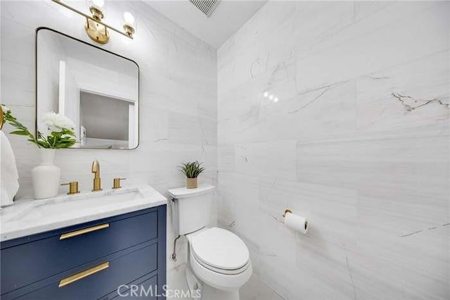 960 S Joliet Cir, Anaheim Hills, CA 92807 - bathroom featuring tile walls, toilet, and vanity