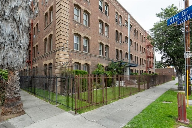 view of property with fence