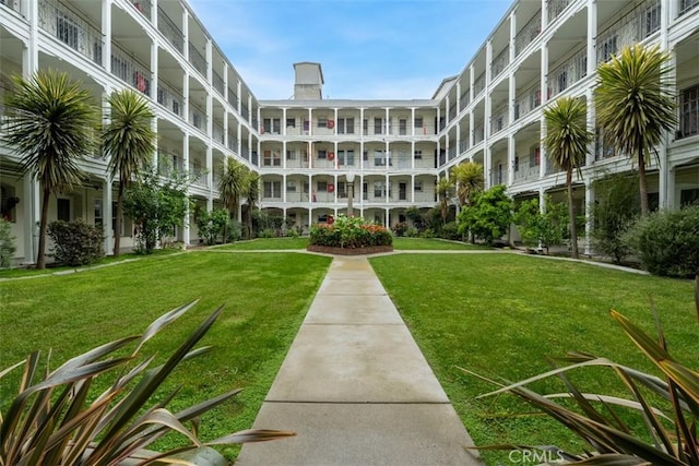 surrounding community with a lawn