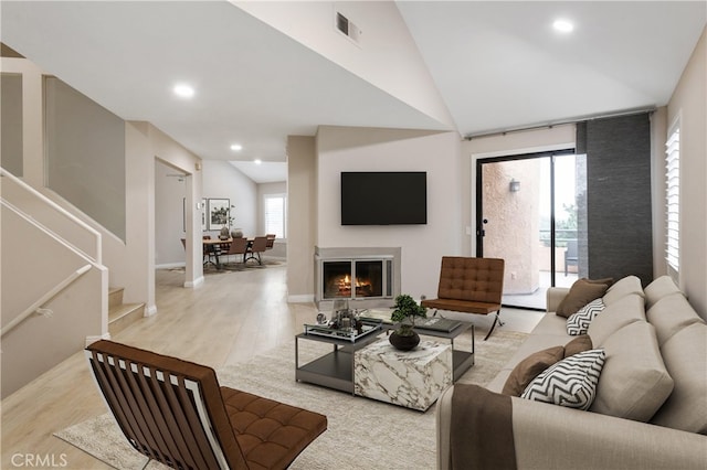 2903 Yucatan Pl Unit A, Diamond Bar, CA 91765 - living area with visible vents, recessed lighting, vaulted ceiling, wood finished floors, and a glass covered fireplace