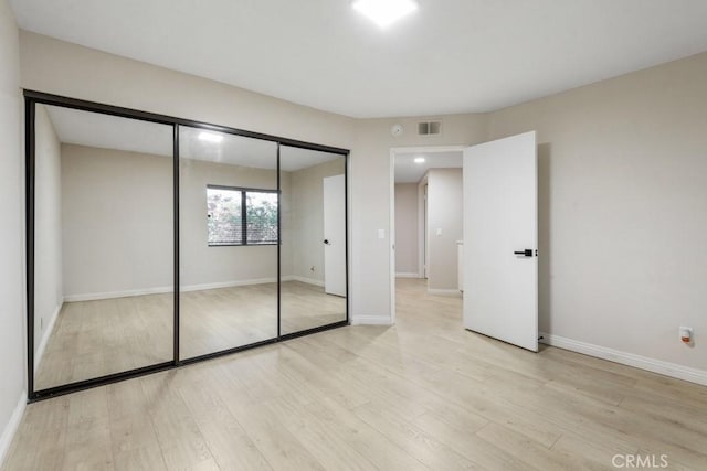 2903 Yucatan Pl Unit A, Diamond Bar, CA 91765 - unfurnished bedroom with visible vents, baseboards, a closet, and wood finished floors
