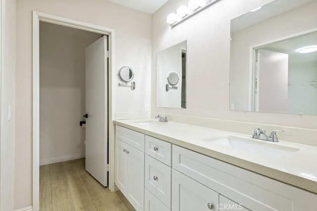2903 Yucatan Pl Unit A, Diamond Bar, CA 91765 - full bath featuring wood finished floors, double vanity, a sink, and baseboards