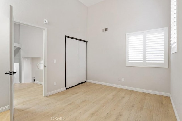 2903 Yucatan Pl Unit A, Diamond Bar, CA 91765 - unfurnished bedroom featuring a high ceiling, wood finished floors, baseboards, and visible vents