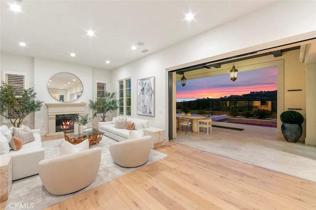 31 Seawatch, Newport Coast, CA 92657 - living area with wood-type flooring, recessed lighting, and a warm lit fireplace