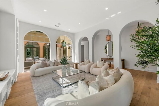 31 Seawatch, Newport Coast, CA 92657 - living room featuring light wood-style floors, recessed lighting, and arched walkways