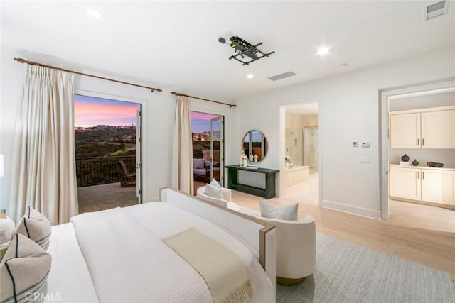 31 Seawatch, Newport Coast, CA 92657 - bedroom featuring access to exterior, light wood-style flooring, recessed lighting, ensuite bath, and baseboards