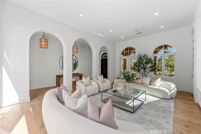 31 Seawatch, Newport Coast, CA 92657 - living area with recessed lighting, arched walkways, light wood-style floors, and baseboards