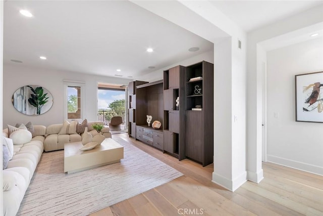 31 Seawatch, Newport Coast, CA 92657 - living area with light wood-style flooring, baseboards, and recessed lighting