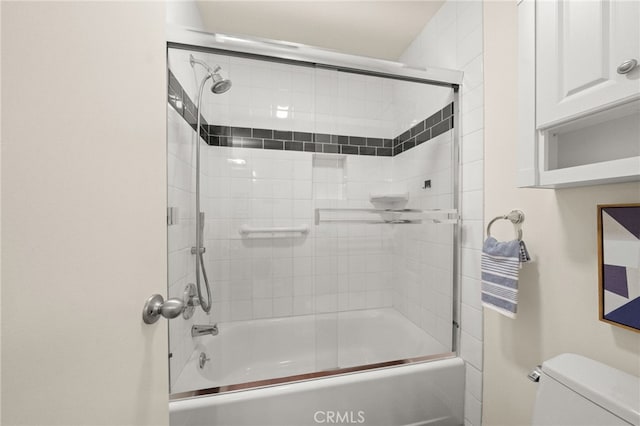 full bathroom featuring toilet and enclosed tub / shower combo