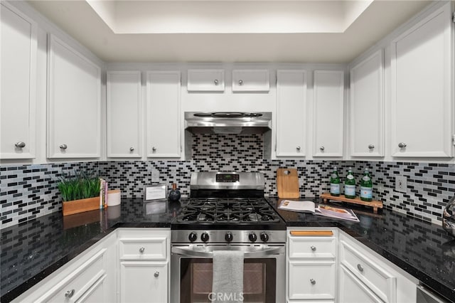 kitchen with extractor fan, white cabinets, and stainless steel gas stove