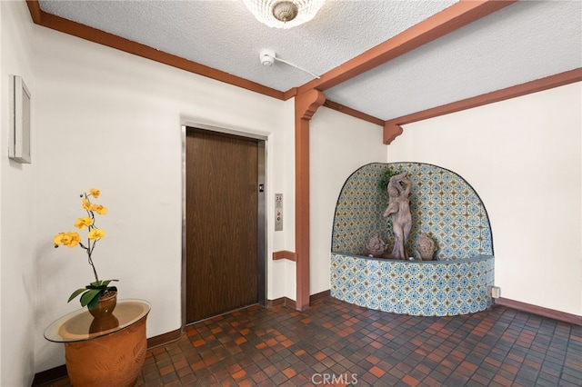 interior space featuring elevator, beamed ceiling, baseboards, and a textured ceiling