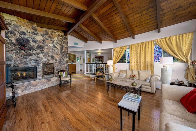 living area featuring high vaulted ceiling, wood finished floors, wood ceiling, beamed ceiling, and a fireplace