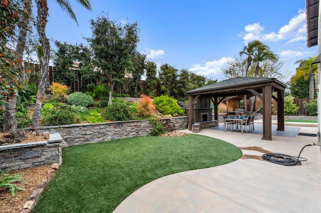 view of yard featuring a gazebo, a fenced backyard, and a patio area