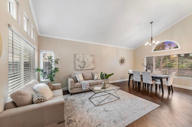 living area with baseboards, a chandelier, a healthy amount of sunlight, and dark wood finished floors