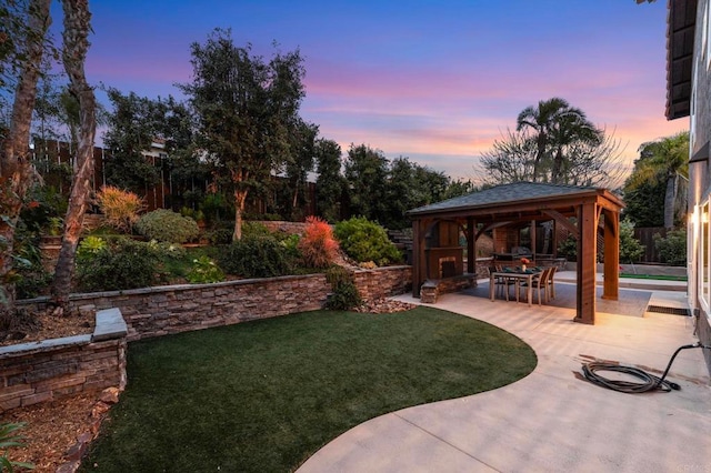 view of yard featuring a gazebo, fence, and a patio area