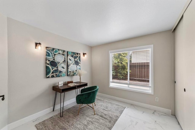 home office with baseboards and marble finish floor