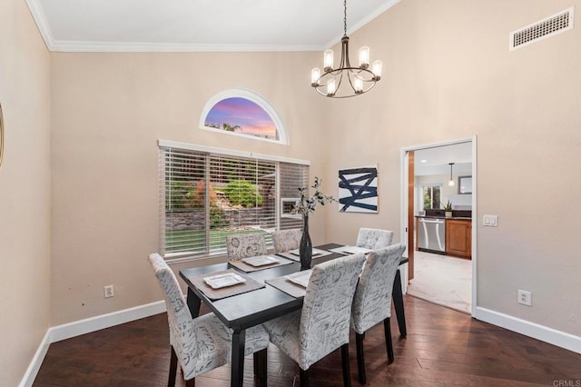 dining area featuring a notable chandelier, visible vents, dark wood-style floors, and a healthy amount of sunlight