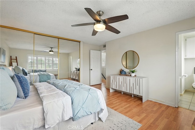 5447 E Centralia St, Long Beach, CA 90808 - bedroom with wood finished floors, a textured ceiling, a ceiling fan, and a closet